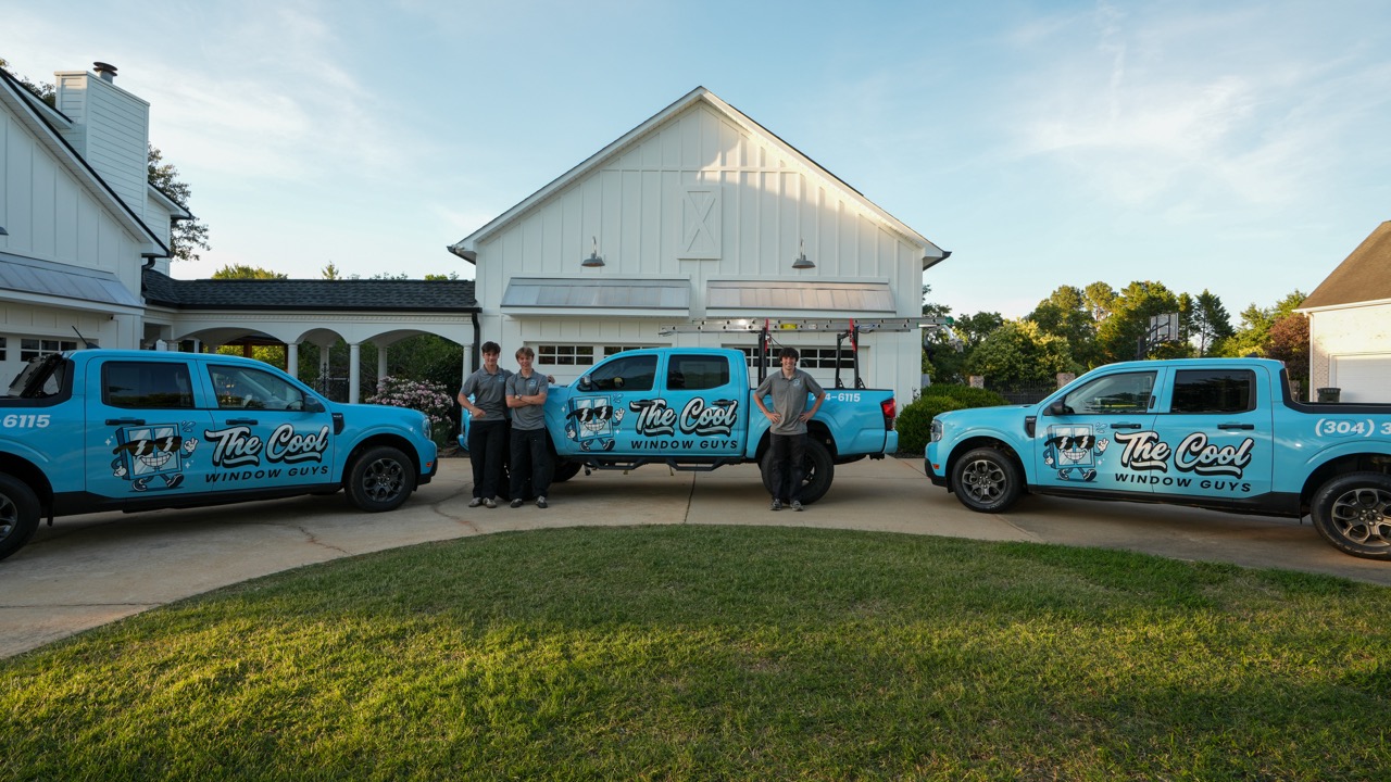 The Cool Window Guys team and branded trucks