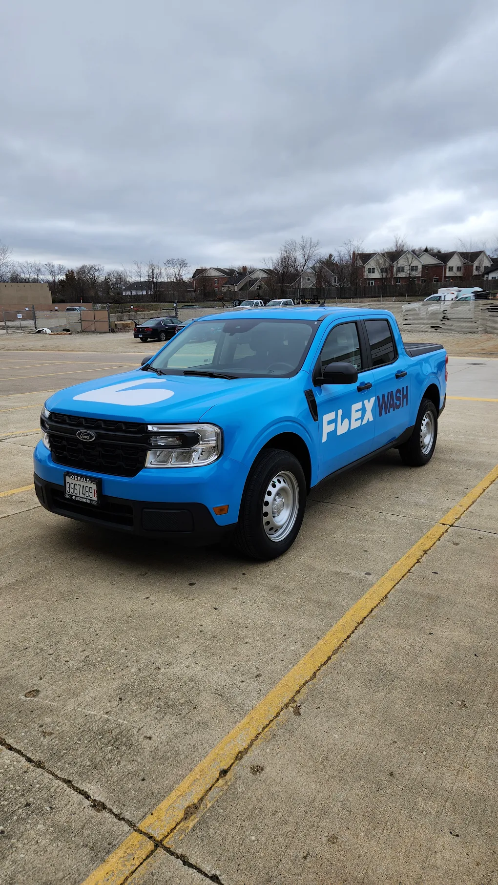 Flex Washing branded blue truck wrap